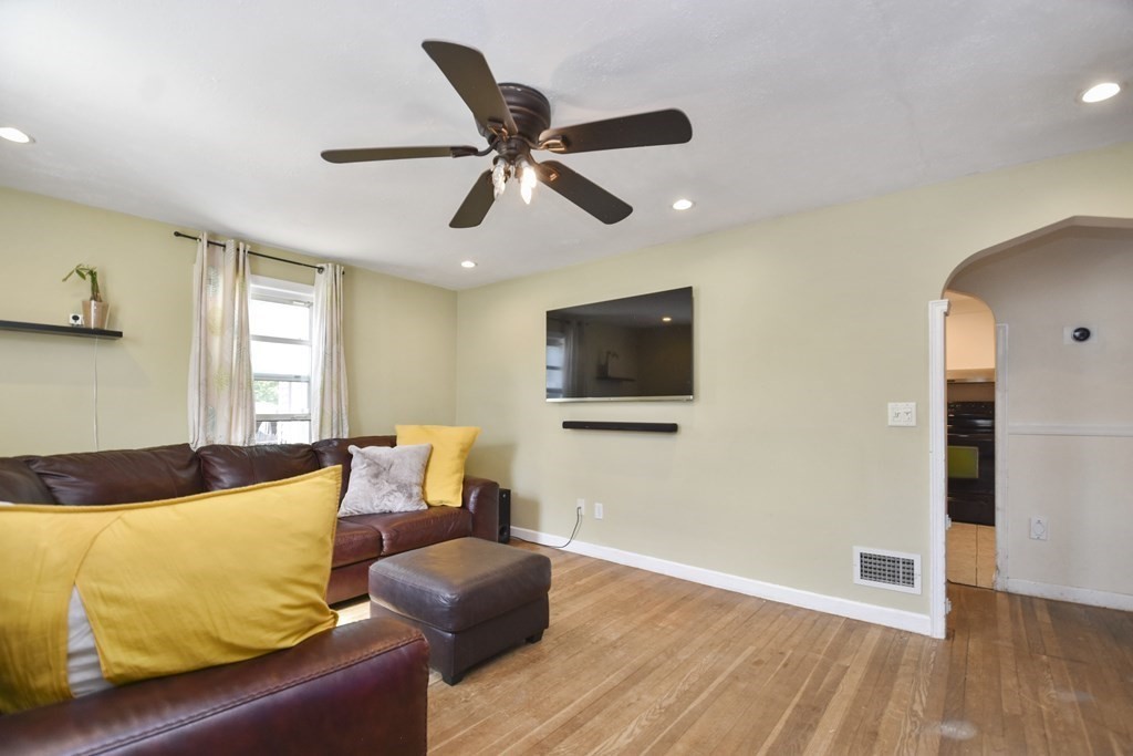 8 Deb Road Woburn, MA 01801 - Photo 7 of 34 a living room with furniture and a flat screen tv