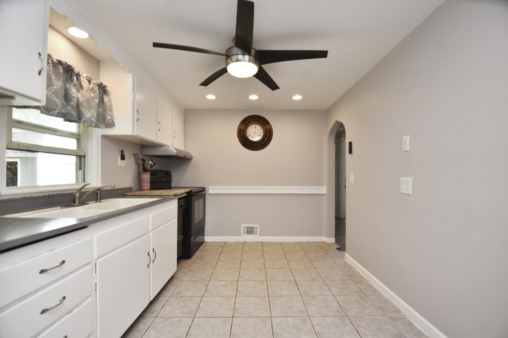 8 Deb Road Woburn, MA 01801 - Photo 10 of 34 a kitchen with a sink and cabinets
