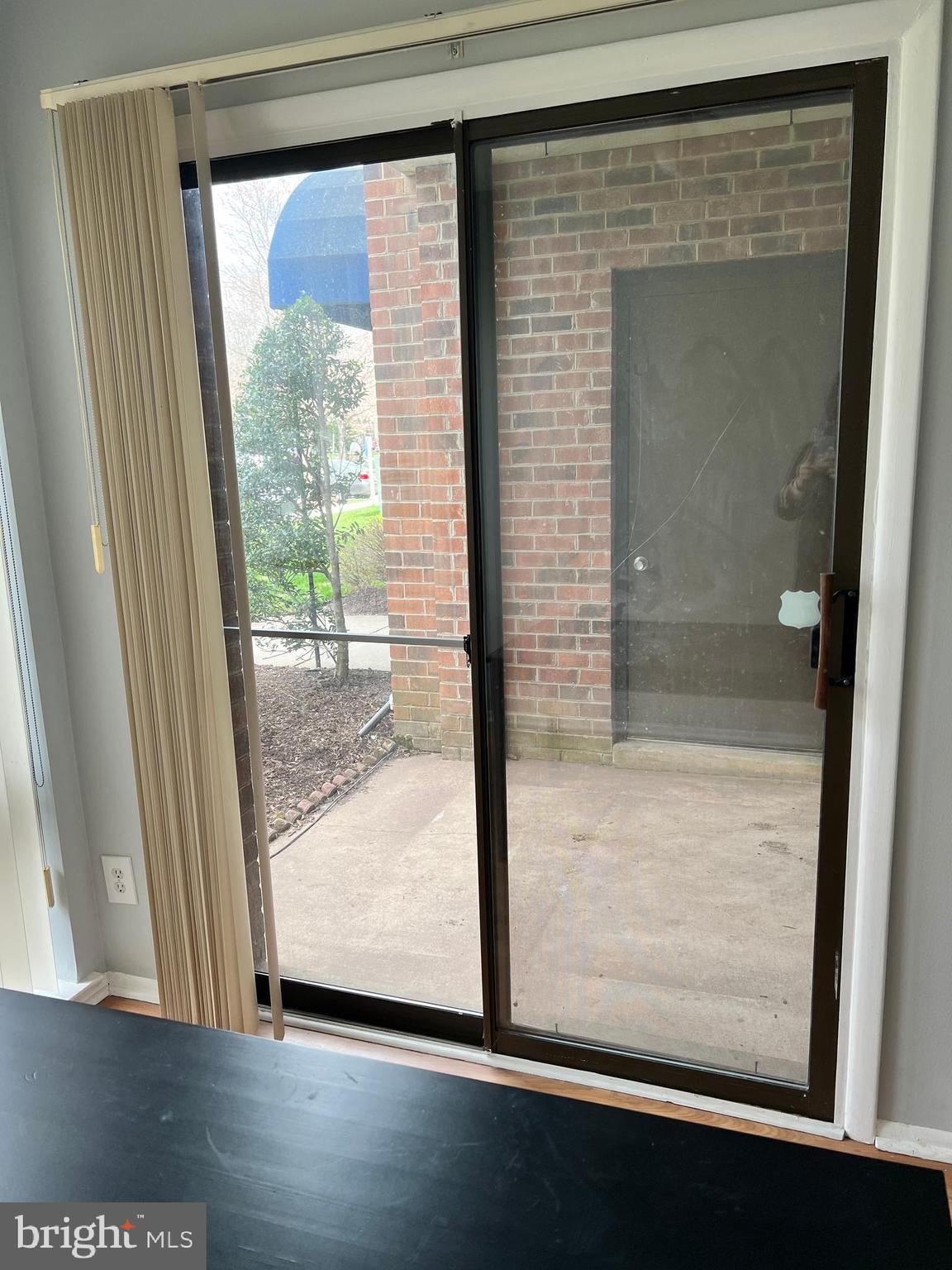 8141 Needwood Road, Unit 104 Derwood, MD 20855 - Photo 14 of 42 a view of a glass door