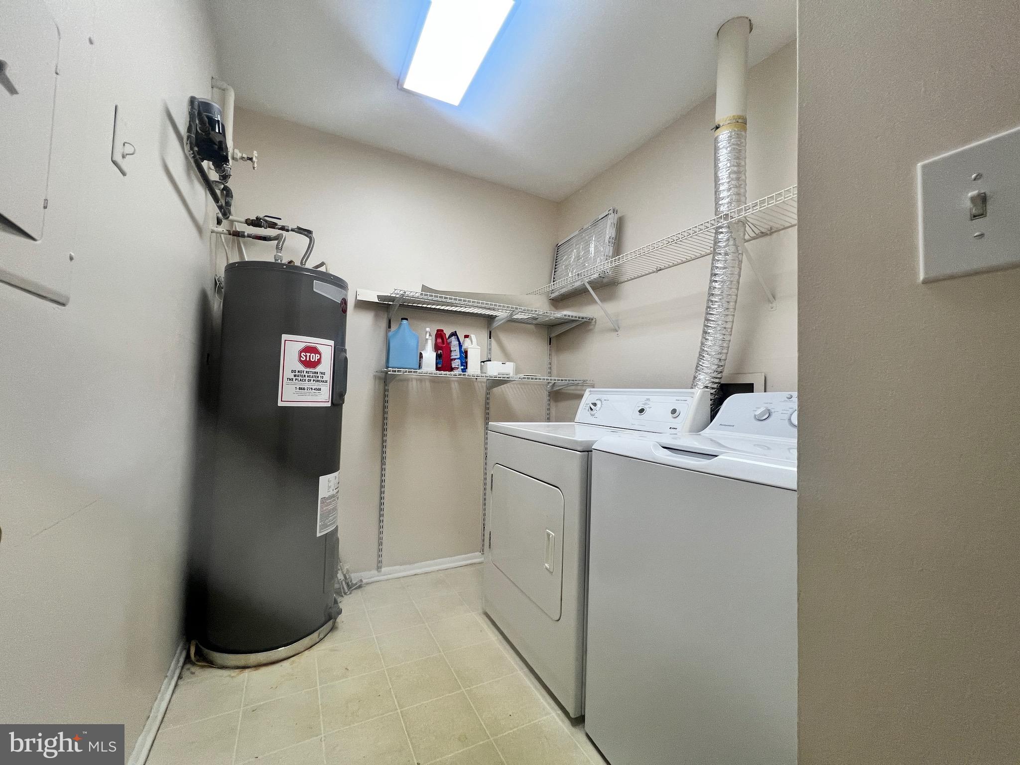 8141 Needwood Road, Unit 104 Derwood, MD 20855 - Photo 18 of 42 a utility room with dryer and washer