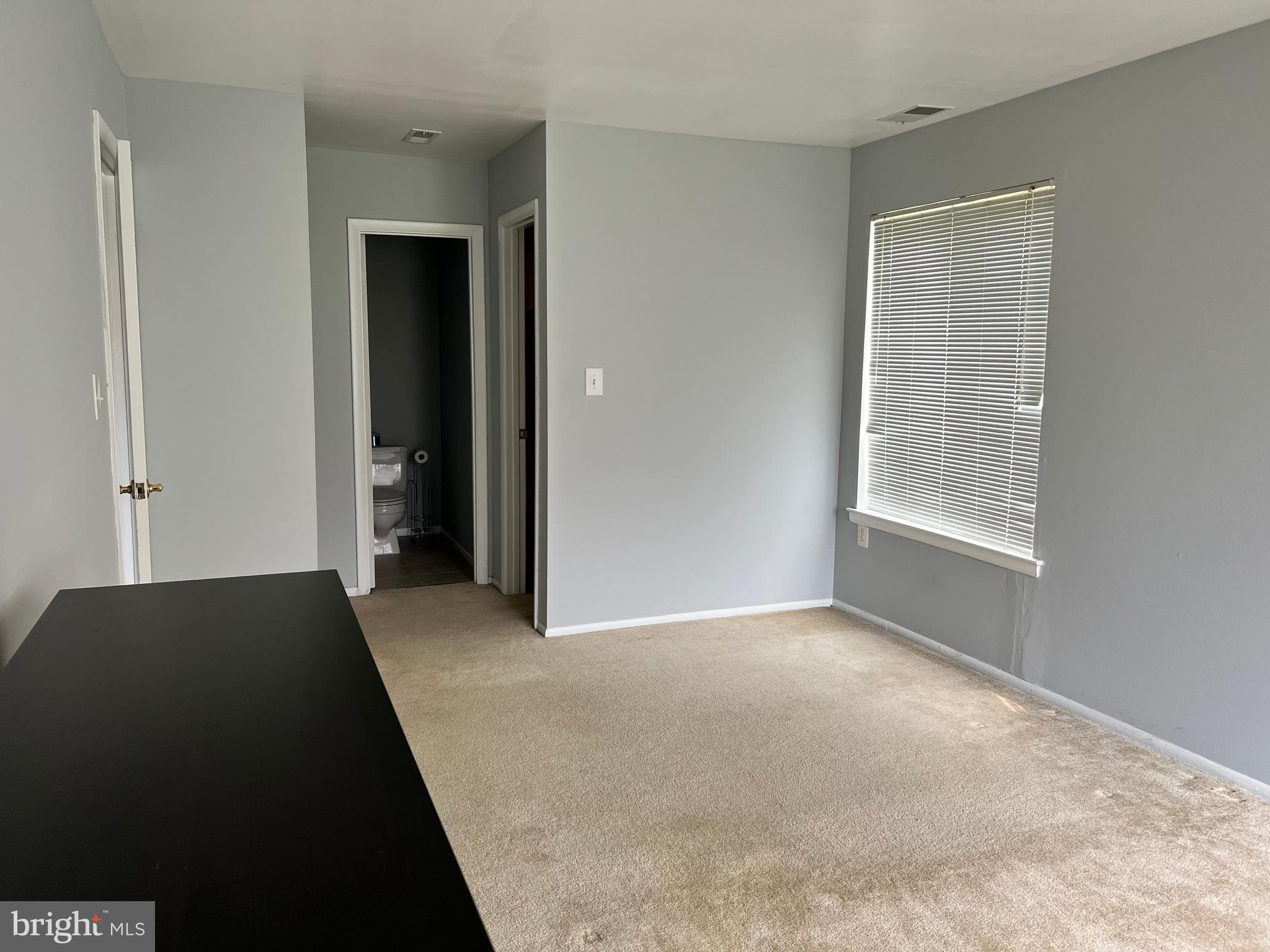 8141 Needwood Road, Unit 104 Derwood, MD 20855 - Photo 19 of 42 a view of a big room with windows and closet