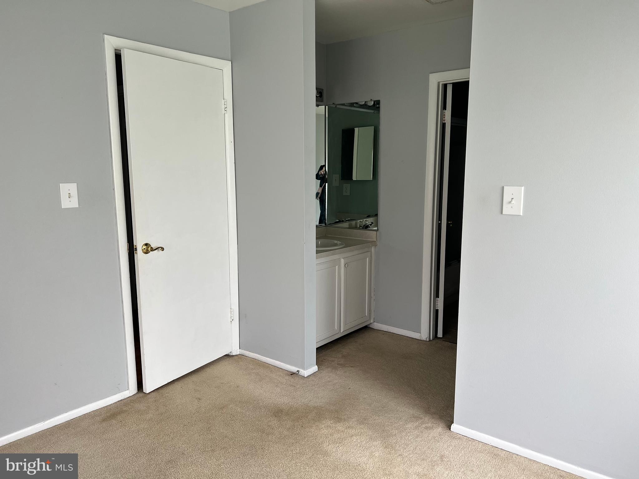 8141 Needwood Road, Unit 104 Derwood, MD 20855 - Photo 22 of 42 an empty room with closet
