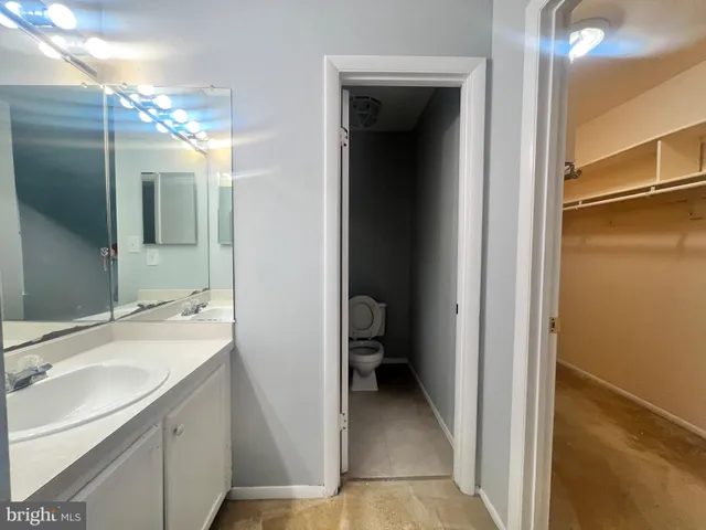 a en suite bathroom with a sink and mirror