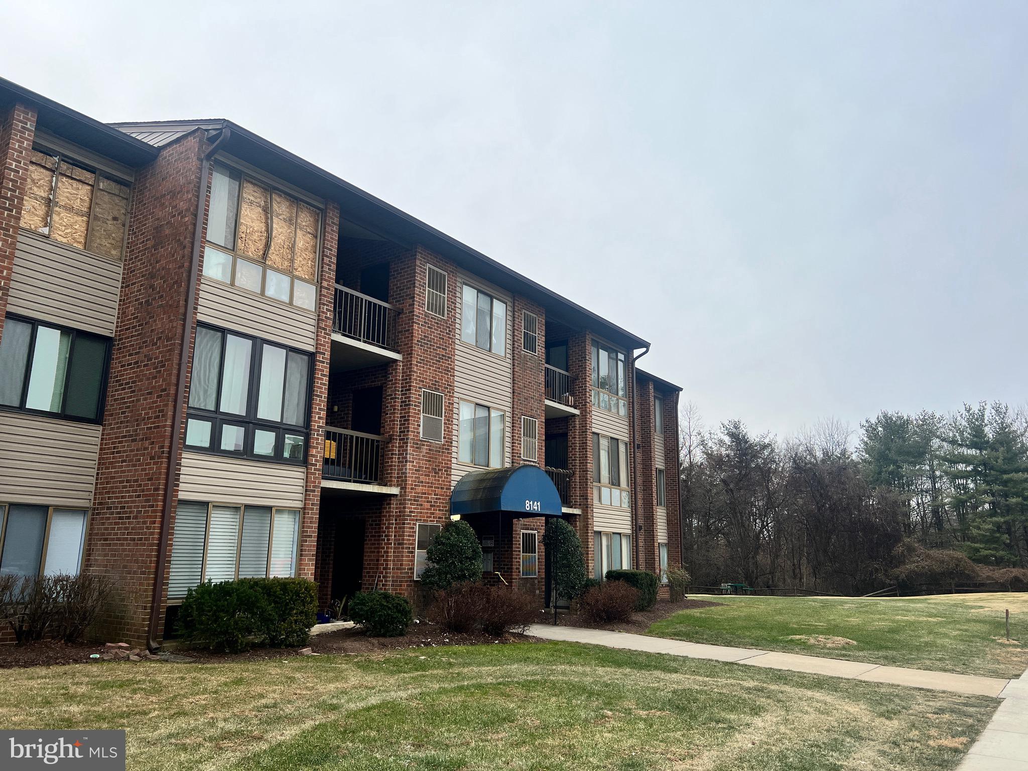 8141 Needwood Road, Unit 104 Derwood, MD 20855 - Photo 40 of 42 a front view of a house with garden