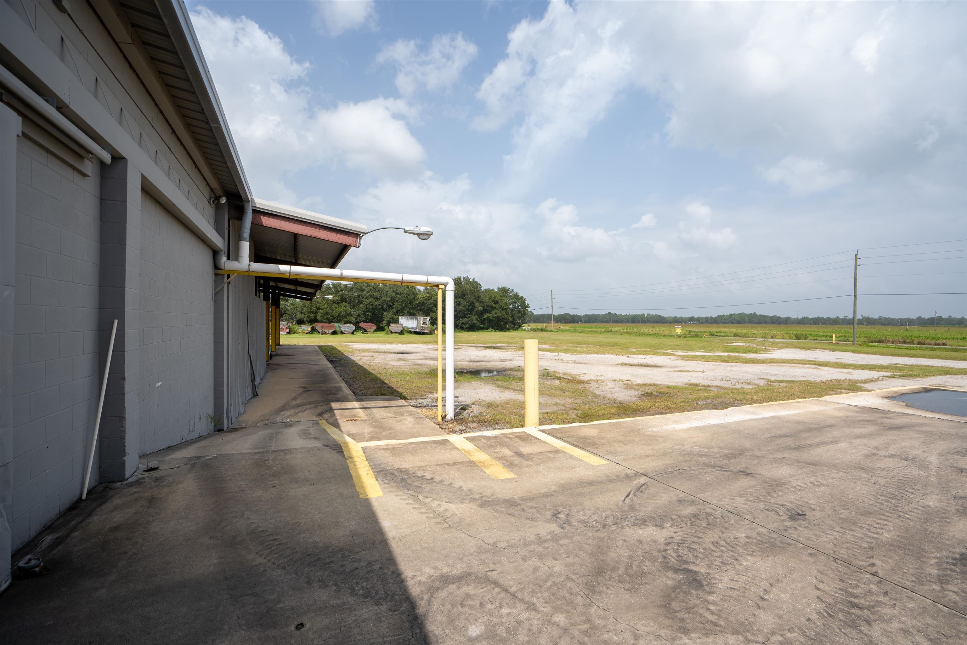 1105 County Road 13A Elkton, FL 32033 - Photo 29 of 57 a view of swimming pool with an outdoor seating