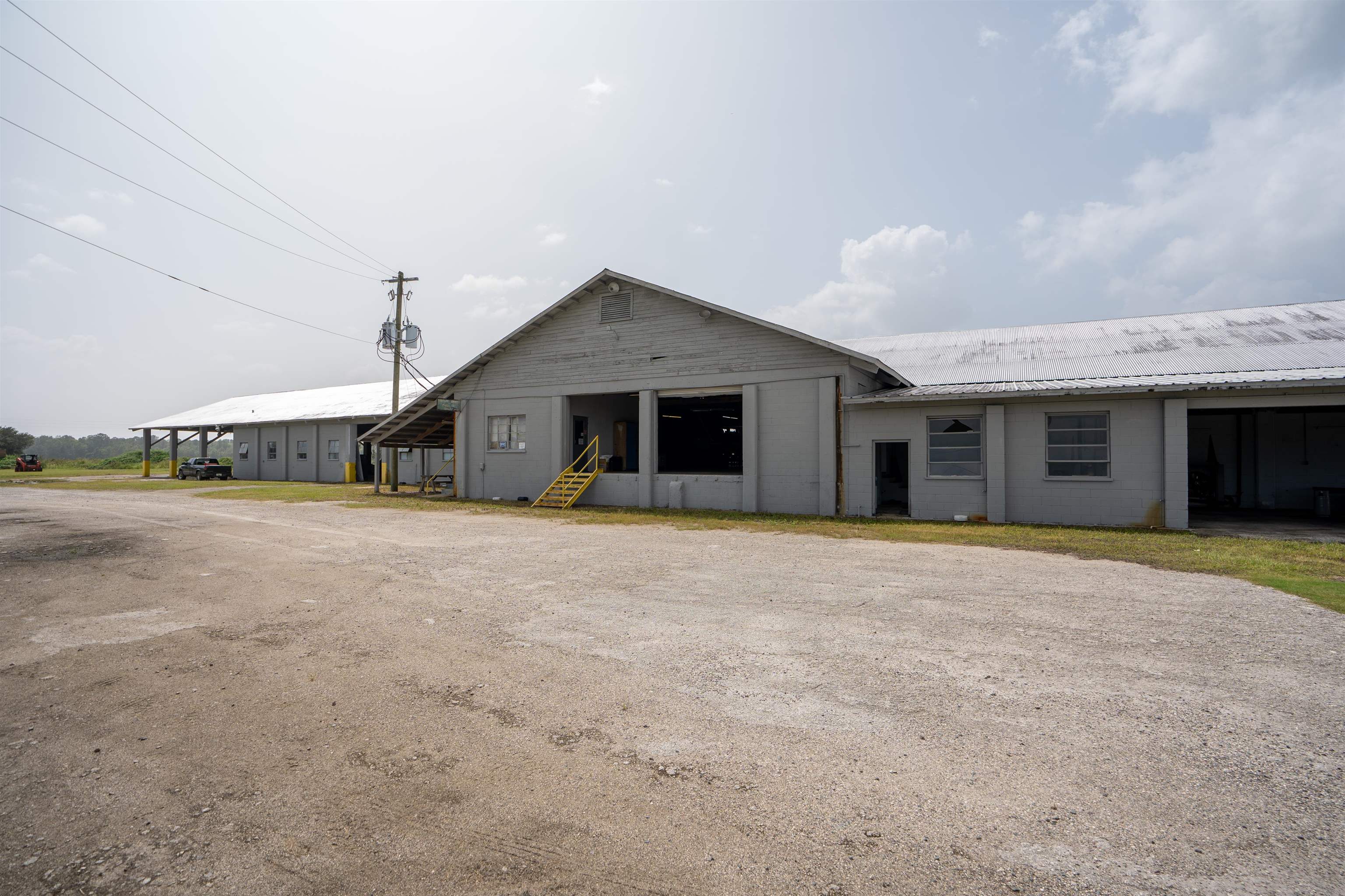 1105 County Road 13A Elkton, FL 32033 - Photo 3 of 57 a front view of a house with a yard and garage