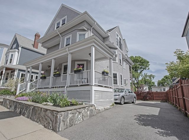 front view of a house with a small yard