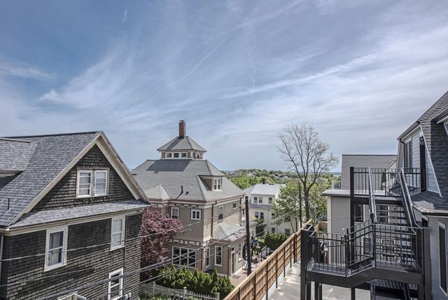 a front view of a house with plants