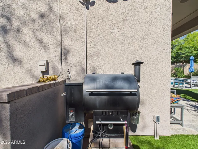 a living room with a couch and a potted plant
