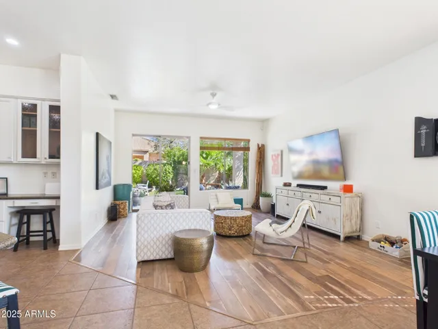 a living room with furniture and a large window