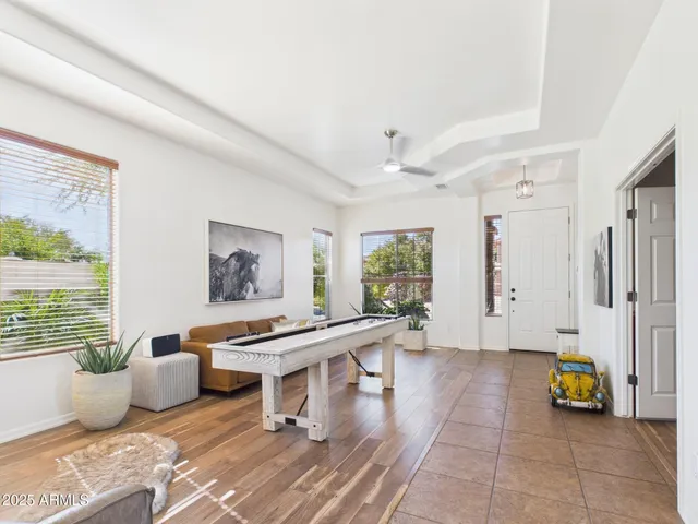 a living room with furniture and a table