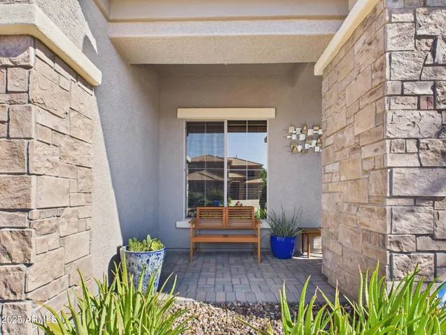 a backyard of a house with outdoor seating