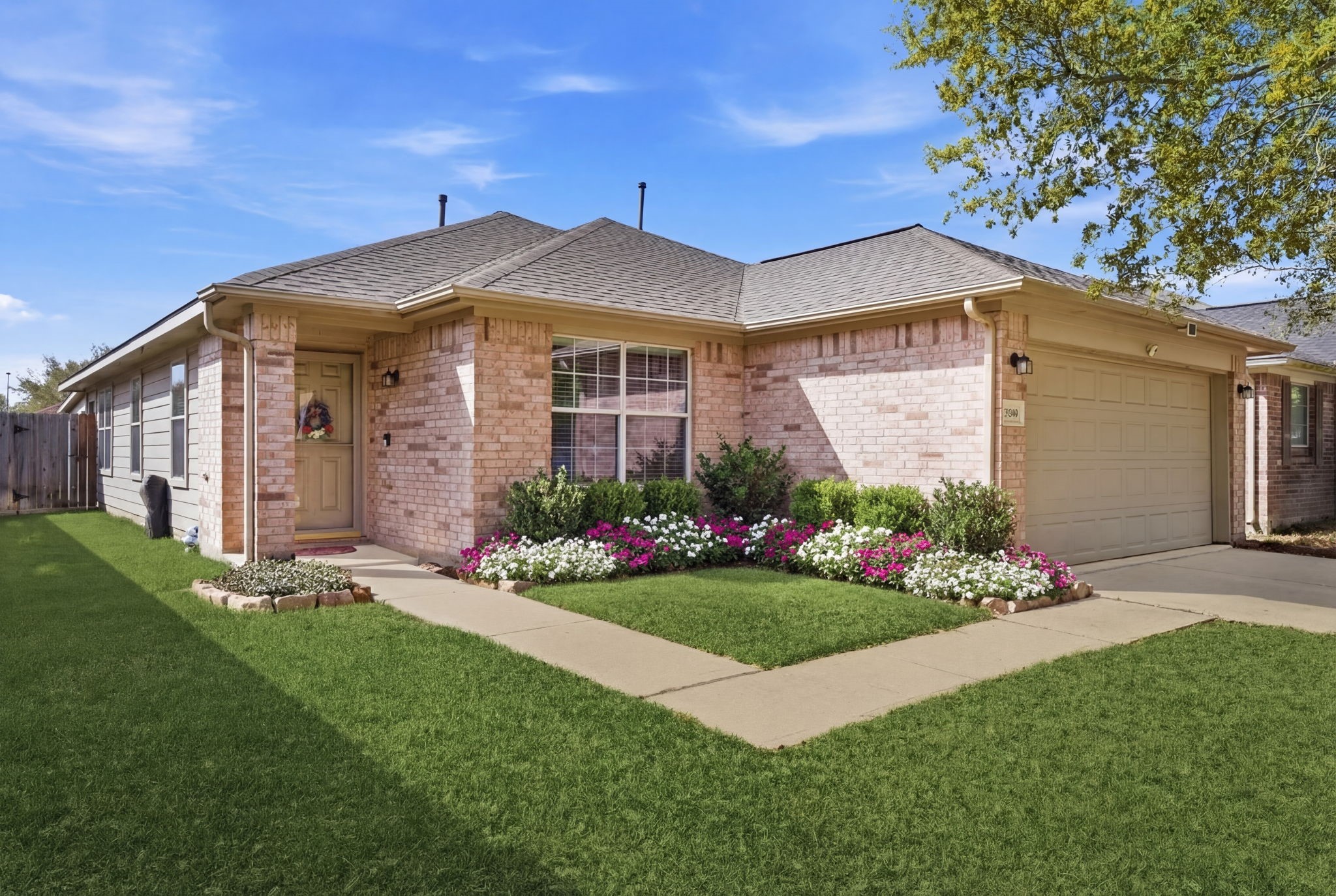 21639 Falvel Misty Drive Spring, TX 77388 - Photo 2 of 11 a front view of a house with a garden