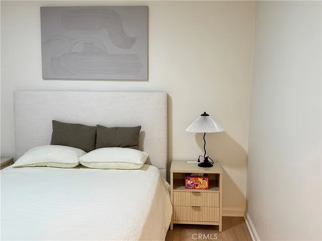 a bedroom with a bed and a table