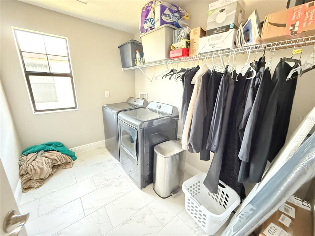 14820 Paddock Pond Avenue Lithia, FL 33547 - Photo 11 of 21 a bedroom with a bed and a window