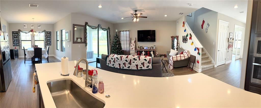 14820 Paddock Pond Avenue Lithia, FL 33547 - Photo 4 of 21 a living room with furniture and a flat screen tv