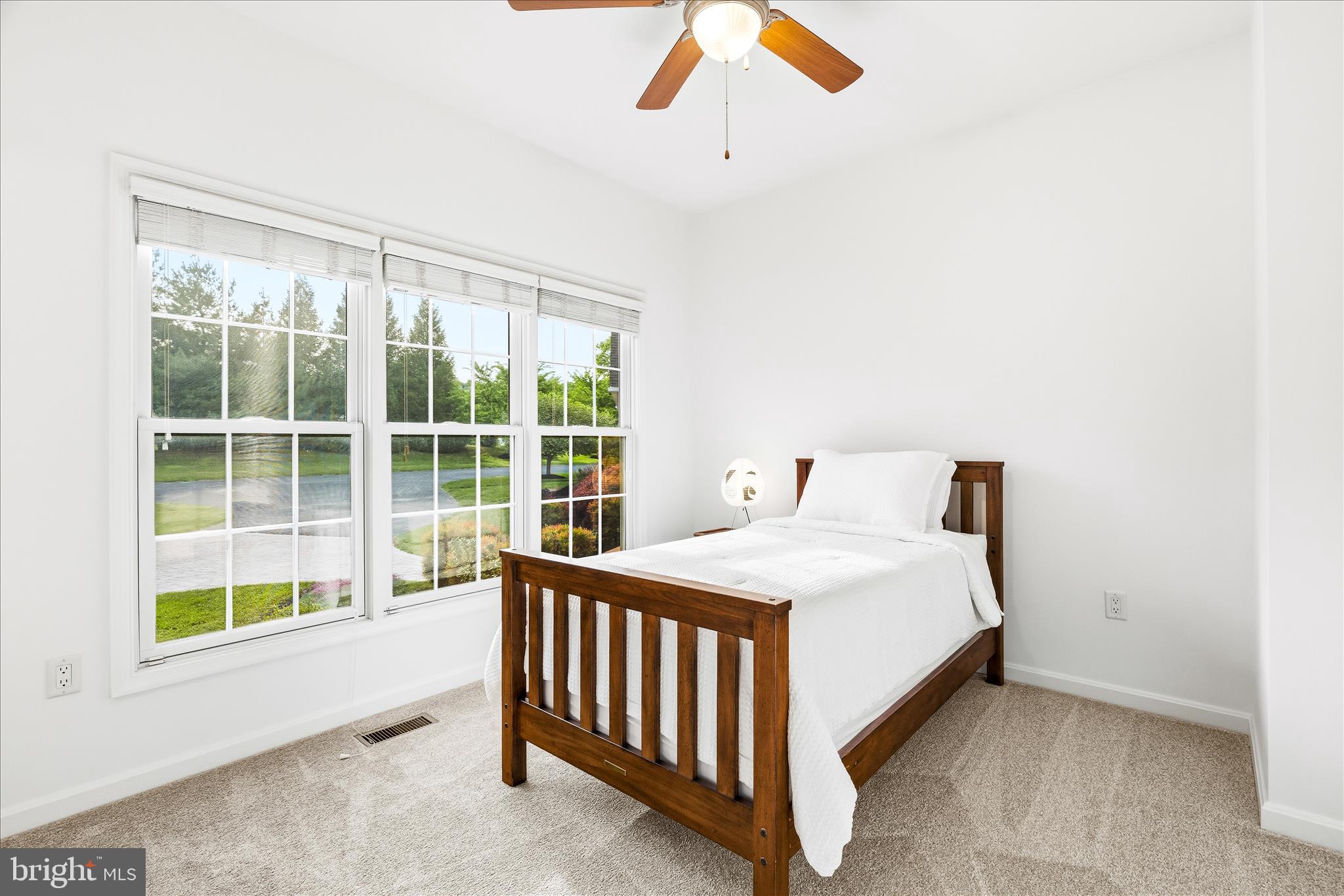 10691 Easterday Road Myersville, MD 21773 - Photo 30 of 79 a bedroom with a bed and a large window