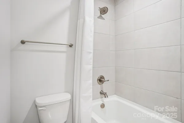 a bath room with a toilet and a sink