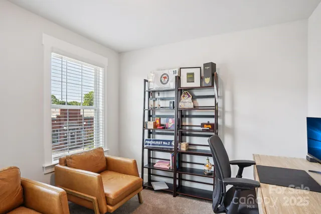 a bedroom with furniture and a window