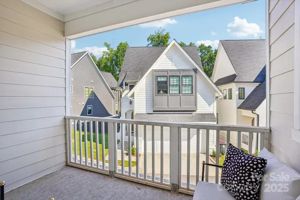 a view of a house with wooden deck