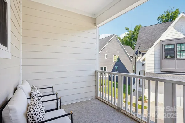 a view of a house with wooden deck