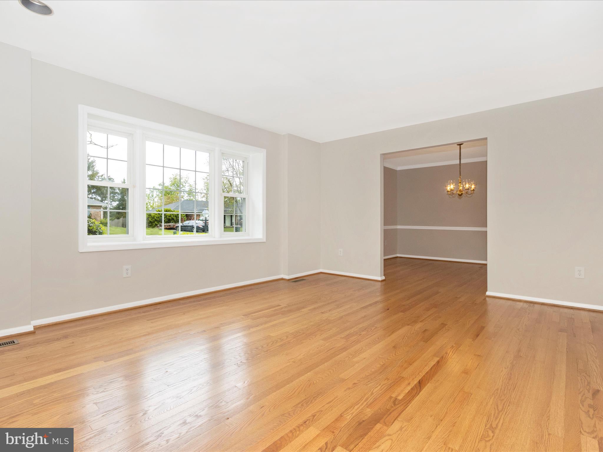 19453 Olney Mill Road Olney, MD 20832 - Photo 3 of 41 an empty room with wooden floor and windows
