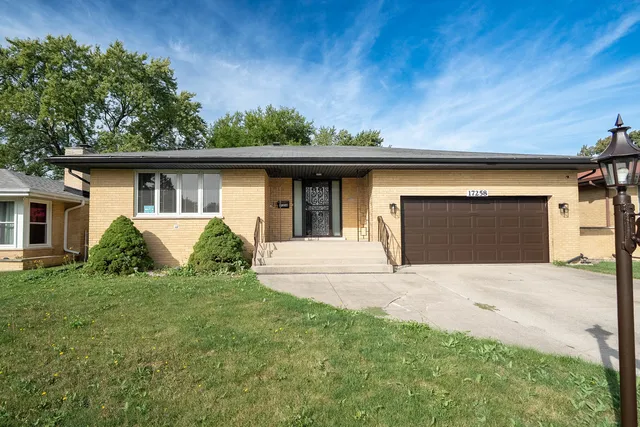 a view of front door and yard