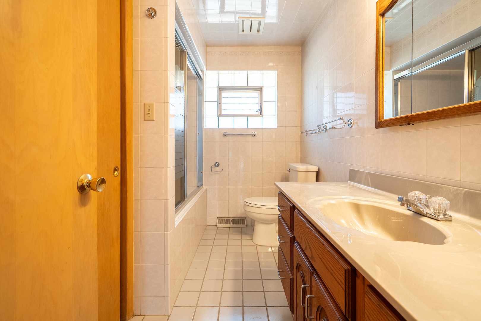 17258 William Street Lansing, IL 60438 - Photo 12 of 34 a spacious bathroom with a granite countertop sink a toilet and a shower
