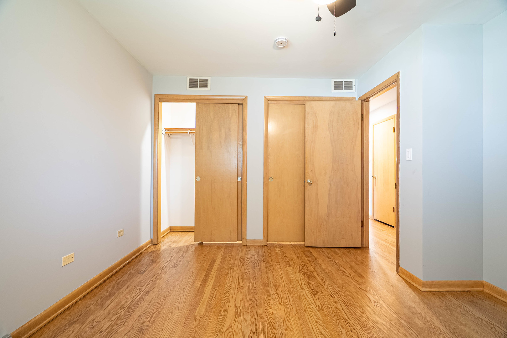 17258 William Street Lansing, IL 60438 - Photo 16 of 34 an empty room with wooden floor and windows