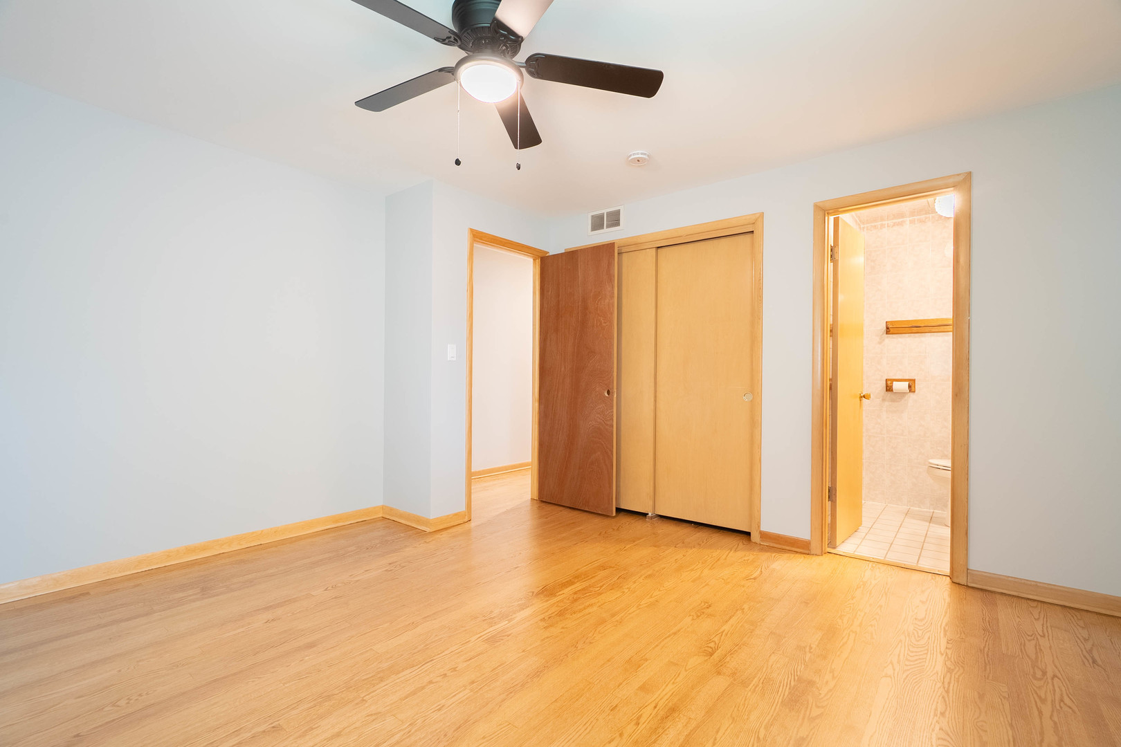 17258 William Street Lansing, IL 60438 - Photo 18 of 34 an empty room with a ceiling fan and carpet