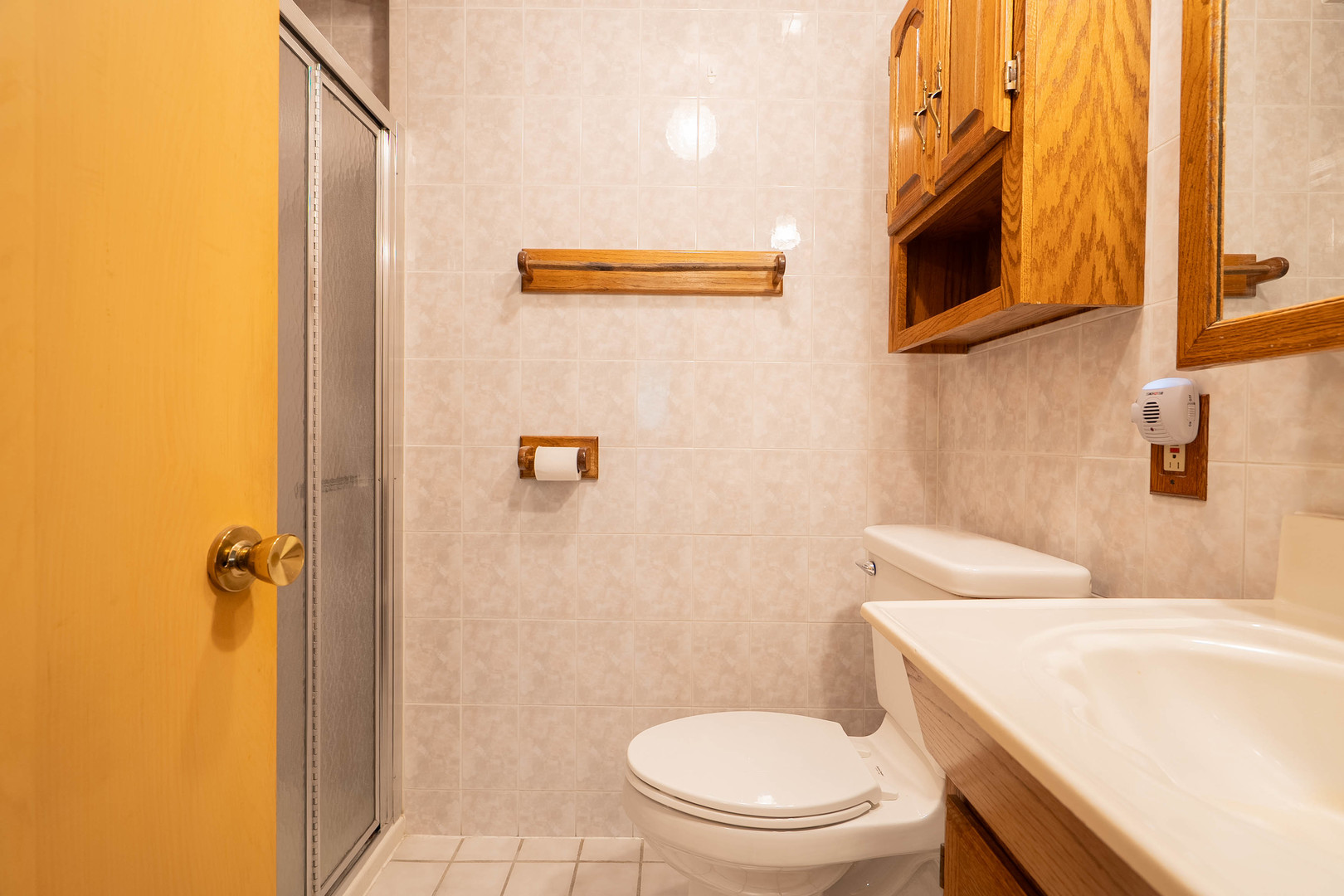 17258 William Street Lansing, IL 60438 - Photo 19 of 34 a white toilet sitting next to a bathroom sink