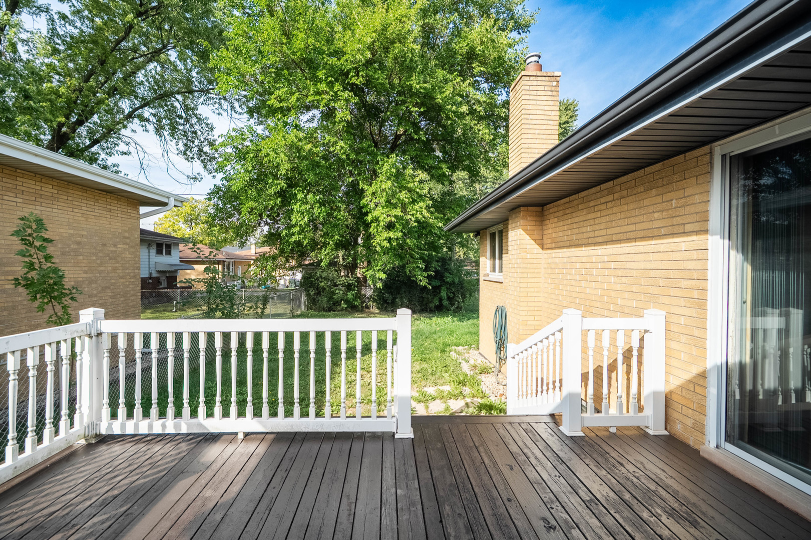 17258 William Street Lansing, IL 60438 - Photo 31 of 34 a view of backyard with a deck and wooden floor
