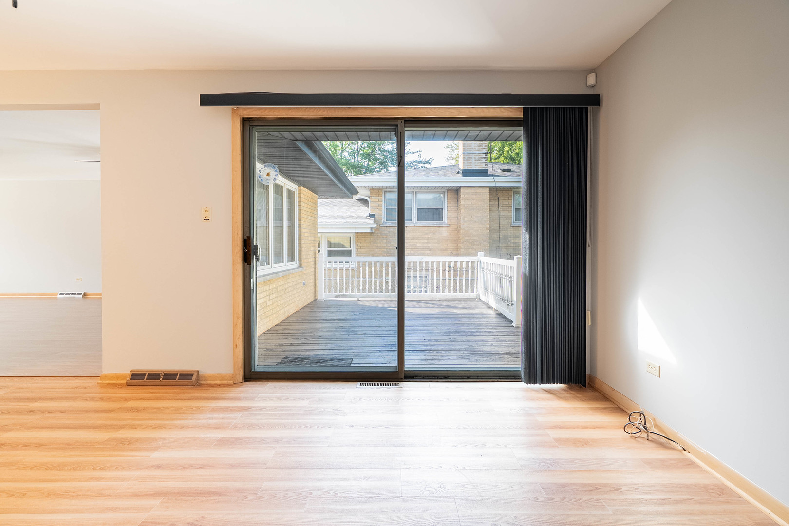 17258 William Street Lansing, IL 60438 - Photo 8 of 34 an empty room with wooden floor and windows