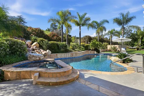 a view of a swimming pool with a sitting space
