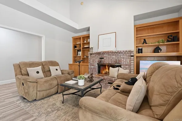 a bed room with a bed and a chair