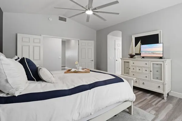 a bedroom with a bed and a window