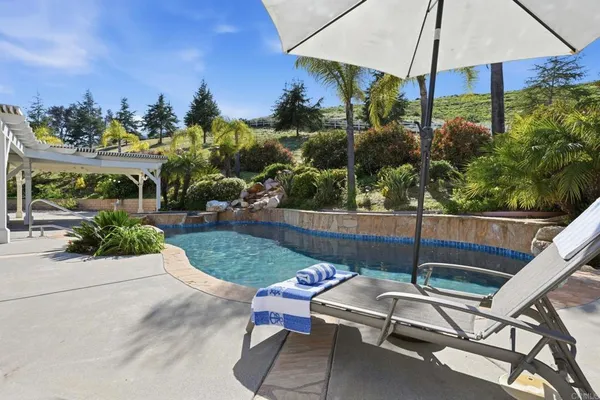 a view of a livingroom with furniture and hardwood floor
