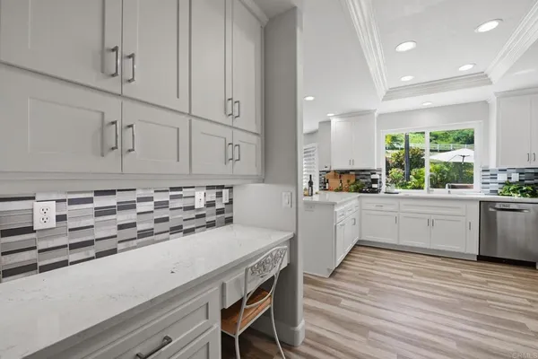 a living room with furniture a window and a fireplace