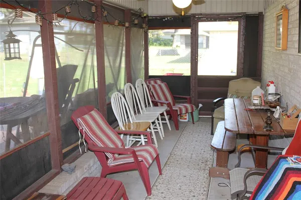 a view of a livingroom with furniture and a window