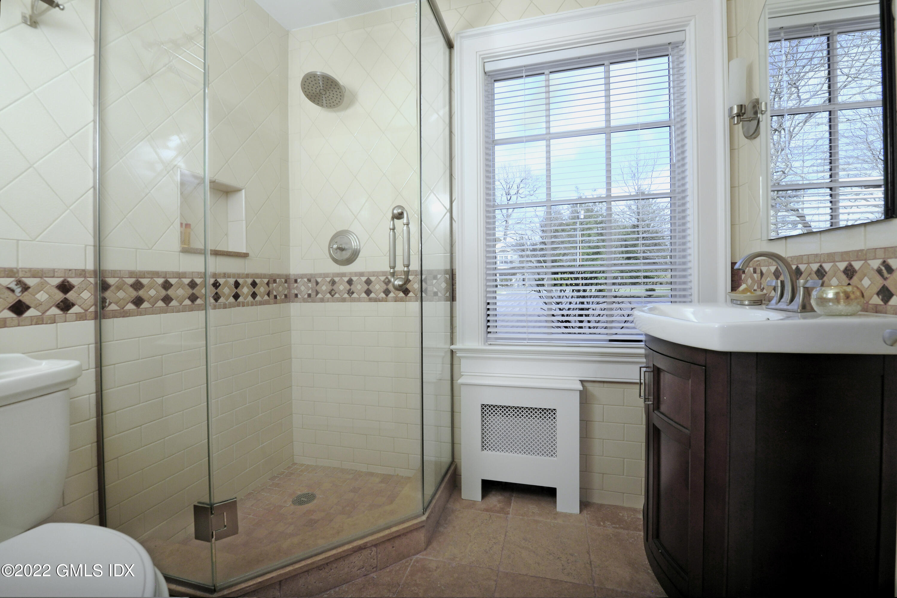 113 Woodside Drive Greenwich, CT 06830 - Photo 16 of 37 a bathroom with a sink toilet and shower