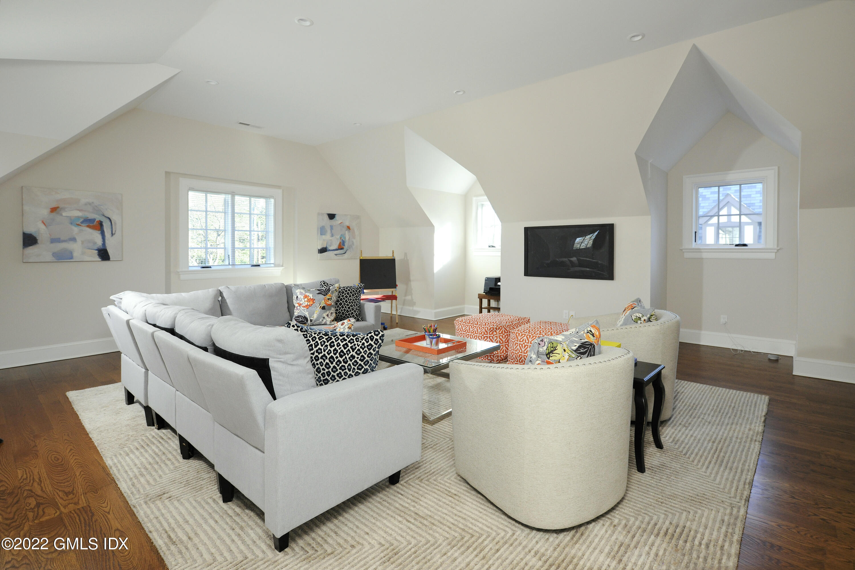 113 Woodside Drive Greenwich, CT 06830 - Photo 21 of 37 a living room with furniture and a flat screen tv