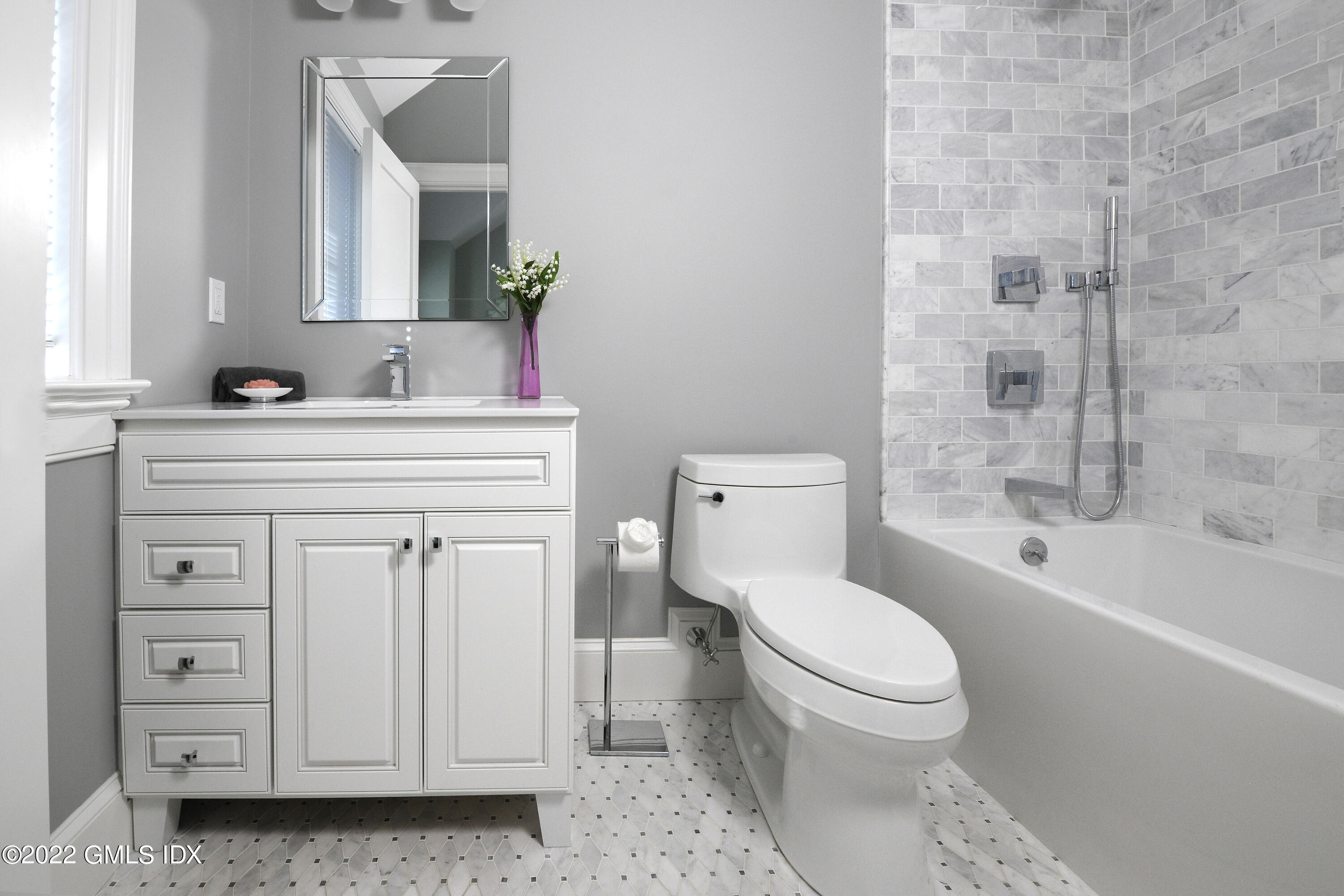 113 Woodside Drive Greenwich, CT 06830 - Photo 26 of 37 a bathroom with a sink a toilet and shower