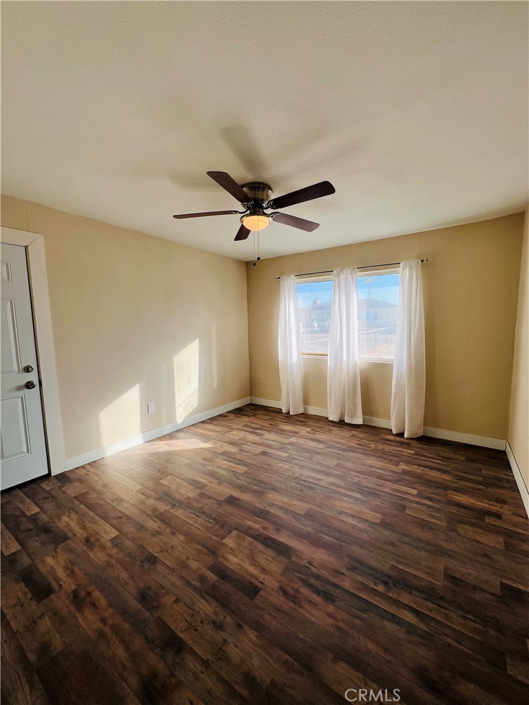 25346 Agate Road Barstow, CA 92311 - Photo 3 of 10 a view of an empty room with a window
