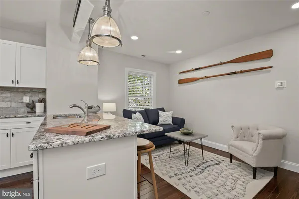 a bedroom with a large bed and a potted plant