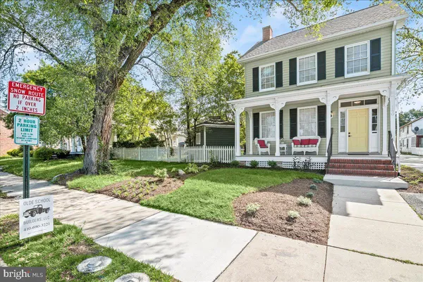 a front view of house and yard with green space