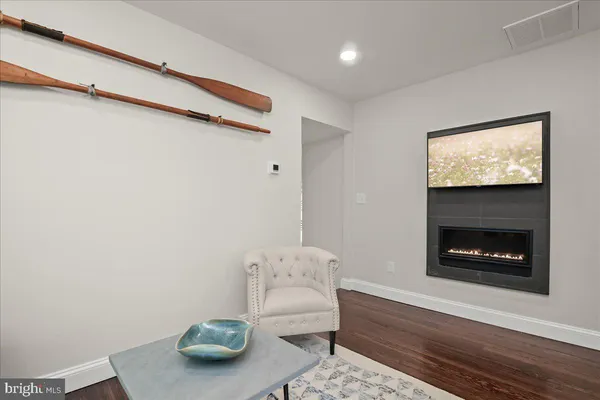 a bedroom with a bed and a large mirror