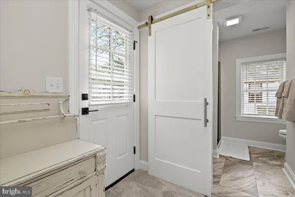 a living room with furniture a dining table and kitchen view
