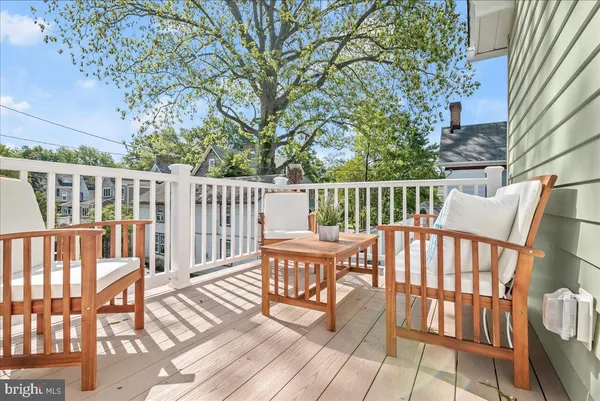 a kitchen with a stove a sink and a microwave