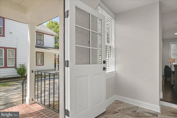 a kitchen with stainless steel appliances granite countertop a sink and a stove