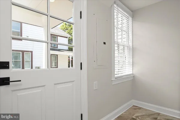 a bathroom with a sink a mirror and a shower